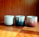 Stylish concrete pots with seasonal hand-poured candles by Carlos Dominguez