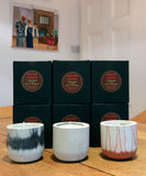 Stylish concrete pots with seasonal hand-poured candles by Carlos Dominguez
