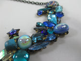 Blue sparkling Rococco 'Bower' necklace by Annie Sherberne