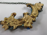 Blue sparkling Rococco 'Bower' necklace by Annie Sherberne
