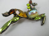 Galloping horse jewelled brooch in yellow and gold by Annie Sherburne