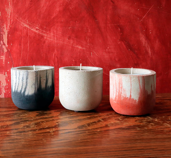 Stylish concrete pots with seasonal hand-poured candles by Carlos Dominguez