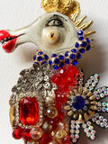 Ornate 'Seahorse' red and blue sparkling brooch by Jan Cooper