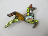 Galloping horse jewelled brooch in yellow and gold by Annie Sherburne